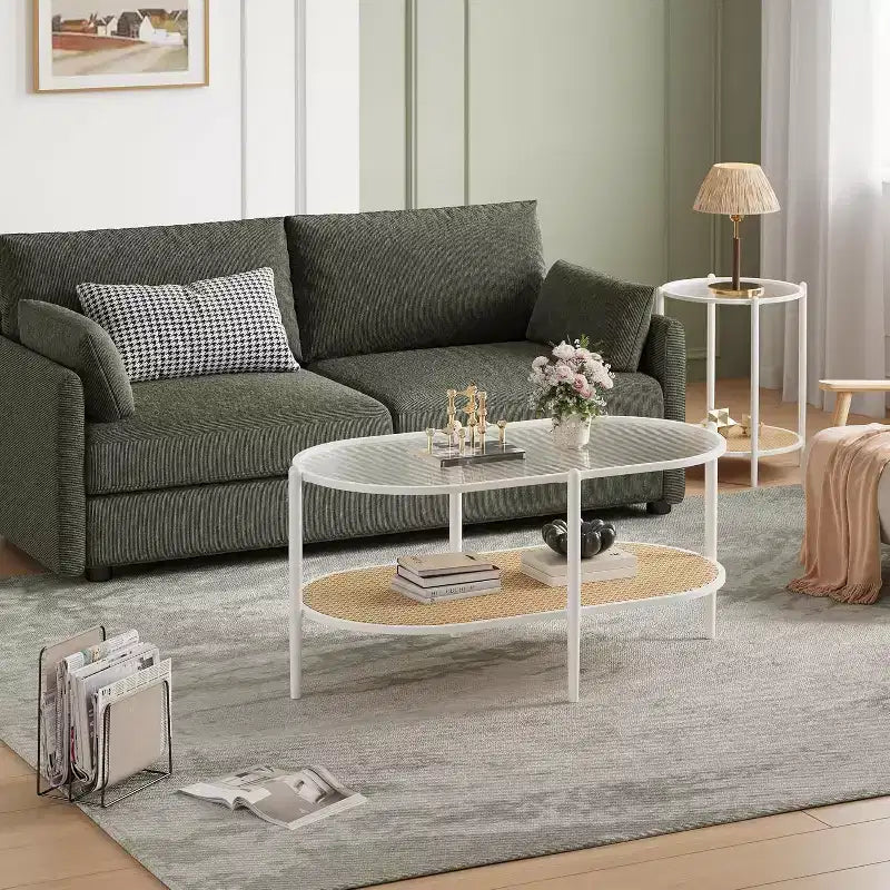 Tavolino ovale a 2 livelli con ripiano in vetro, mensola in rattan e struttura in metallo, nero/bianco