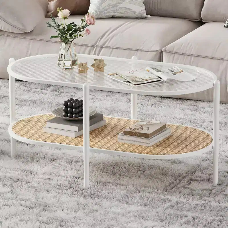 Tavolino ovale a 2 livelli con ripiano in vetro, mensola in rattan e struttura in metallo, nero/bianco